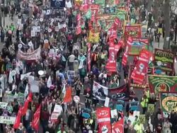 MS Public demonstrators with orange flags and placard / London, England, Great Britain  Stock Footage