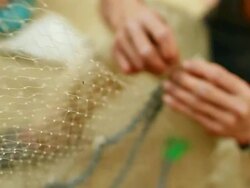 CU R/F ZI ZO SLO MO Shot of hands working on net / Muang Ngoi, Luang Prabang, Laos Stock Footage