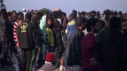 Migrants on Deck of HMS Bulwark in Catania News Clip