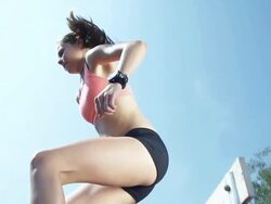 HD SUPER SLOW-MO: Woman Jumping Over Hurdles Stock Footage
