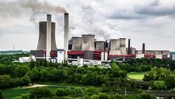 AERIAL: Power plant burning fossil fuel Stock Footage