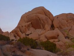 Skull Rock sunset time lapse in Joshua Tree National Park Stock Footage