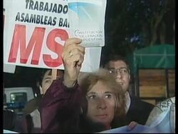 Reax to resignation of economic minister + speculation on Duhalde's future + demos News Clip