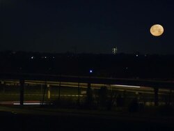 Night time lapse traffic across interstate bridges as the moon sets. Stock Footage