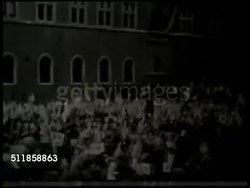 1941: TRIPARTITE PACT: HA REVERSE PAN Crowd waving Japanese & Italian flags in piazza of Palazzo Venezia, Japanese Foreign Minister Yosuke Matsuoka (1880-1946) w/ unidentified man walking to balcony w/ Fascist dictator Benito Mussolini (Il Duce). Instructional Video
