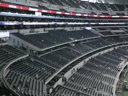  PAN Pre-game field and stands at Cowboys Stadium from behind end zone / Arlington, Texas, United States Stock Footage