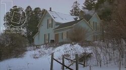 Static shot of a country home in the countryside by day in the snow Stock Footage