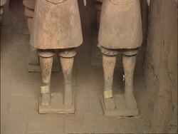 Terracotta Warriors feet, tilt up to rest of body, Museum of Qin, Xian, China Stock Footage