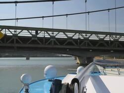 Passing Under Bridge on a River Boat Stock Footage