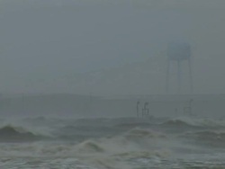 MS Shot of storm waves with storm surge roll into city / Gulfport, Mississippi, United States Stock Footage