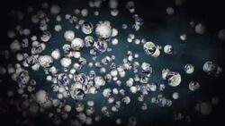Miniature globes float against a gray background. Stock Footage