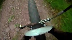 The front wheel of a bicycle steers down a rocky mountain path. Stock Footage
