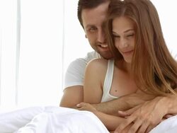 HD: Couple Embracing On A Bed Stock Footage