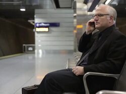 MS Middle aged businessman using cellular phone inside commuter transit station / Minneapolis, Minnesota, United States Stock Footage