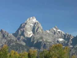 Grand Tetons Mountain Range over fall colors Stock Footage