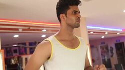 Young man running on treadmill Stock Footage