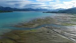 Aerial view flying over braided river mouth Stock Footage