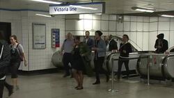Commuters Passing Through Brixton Underground Station News Clip