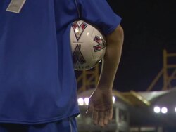 LA CU TD TU Soccer player standing in empty stadium at night / Sheffield, England, UK Stock Footage