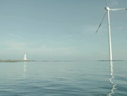 WS View of windmill and lighthouse in Jeju island / Ansan, Gyeonggido, South Korea Stock Footage