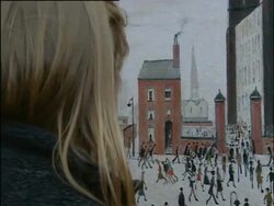 Manchester, The Lowry Gallery interior with female visitor admiring paintings. Detail of Lowry painting and artworks mounted on wall; 2004; short sequence. Stock Footage