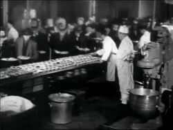 B/W 1930s wide shot line of men being served food in soup kitchen / Great Depression Stock Footage