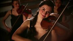 Smiling women playing violin in orchestra Stock Footage