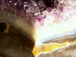 ECU SLO MO Rotating piece of purple and amber crystal / Miami, Florida, United States Stock Footage