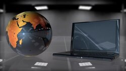 An animated globe of the Earth revolves next to a laptop computer. Stock Footage