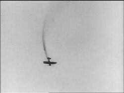 B/W 1910s biplane spiraling downwards trailing smoke behind it / World War I / newsreel Stock Footage