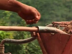 CU PAN TU Gold mining and man putting dirt in machine / Jacobina, Bahia, Brazil Stock Footage