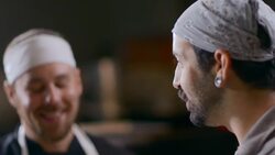 Restaurant cooks chat in kitchen and smell hot chili peppers Stock Footage