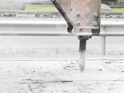 Jackhammer machine digging up concrete road, Pneumatic drill breaking street Stock Footage