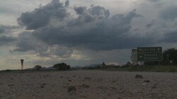 A road cuts through the plains of the Namib Desert. Stock Footage