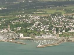 WS AERIAL View of sea shore and row houses in city / Brittany, Channel Isles Stock Footage