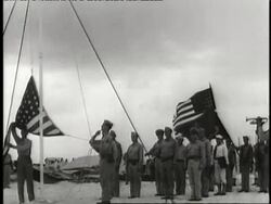 A group of soldiers raise a flag on Wake Island. News Clip