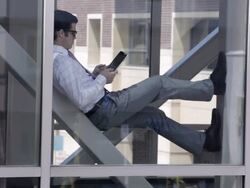 MS Young businessman working on tablet device / Minneapolis, Minnesota, United States Stock Footage