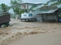 POV driving through extreme flood flowing through village and almost getting swept away, Philippines, Typhoon Parma, 2009 Stock Footage