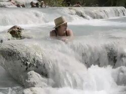 WS View of Woman relaxing in hot spring, thermal pools of sulphurous water / Saturnia, Tuscany, Italy Stock Footage