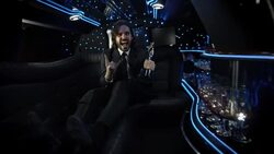 Celebrity in limousine shows off awards trophy and cheers at camera at awards show Stock Footage