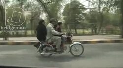 Family riding a bike, Lahore Stock Footage