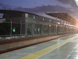 HD Train leaving the station in the rain Stock Footage