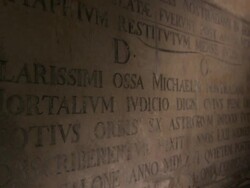Inscriptions cover a stone wall at the grave of Nostradamus. Stock Footage