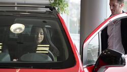 Young woman buying a new car Stock Footage