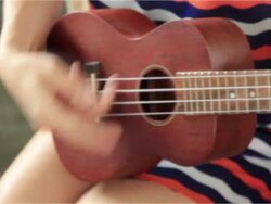 girl playing ukulele Stock Footage