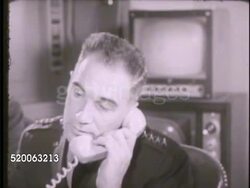 1963: UNITED STATES AIR FORCE OPERATORS: INT VS Operators sitting at panel w/ telephones, male picks up telephone receiver, talking (no SOT). Military, US Air Force, communications Instructional Video