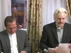 Julian Assange prepares to address the media News Clip