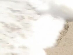 Footprint Being Washed Away Stock Footage