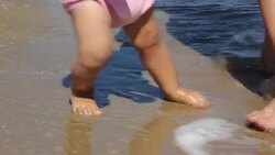 Baby learning to walk Stock Footage