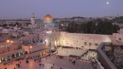 Worshipers and tourists visit and pray at the Wailing Wall in Jerusalem. Stock Footage